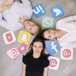 Young happy friend lying on floor with social media logos