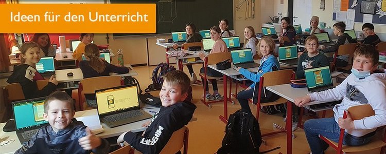 Bild einer Schulklasse mit digitalen Geräten 